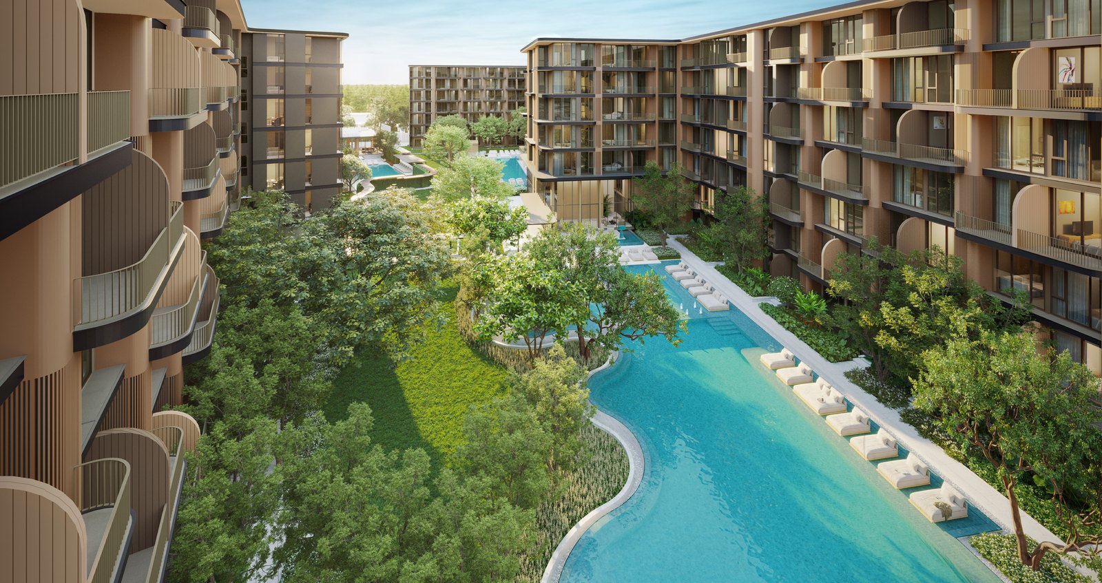A long pool winding between two buildings, seen from above