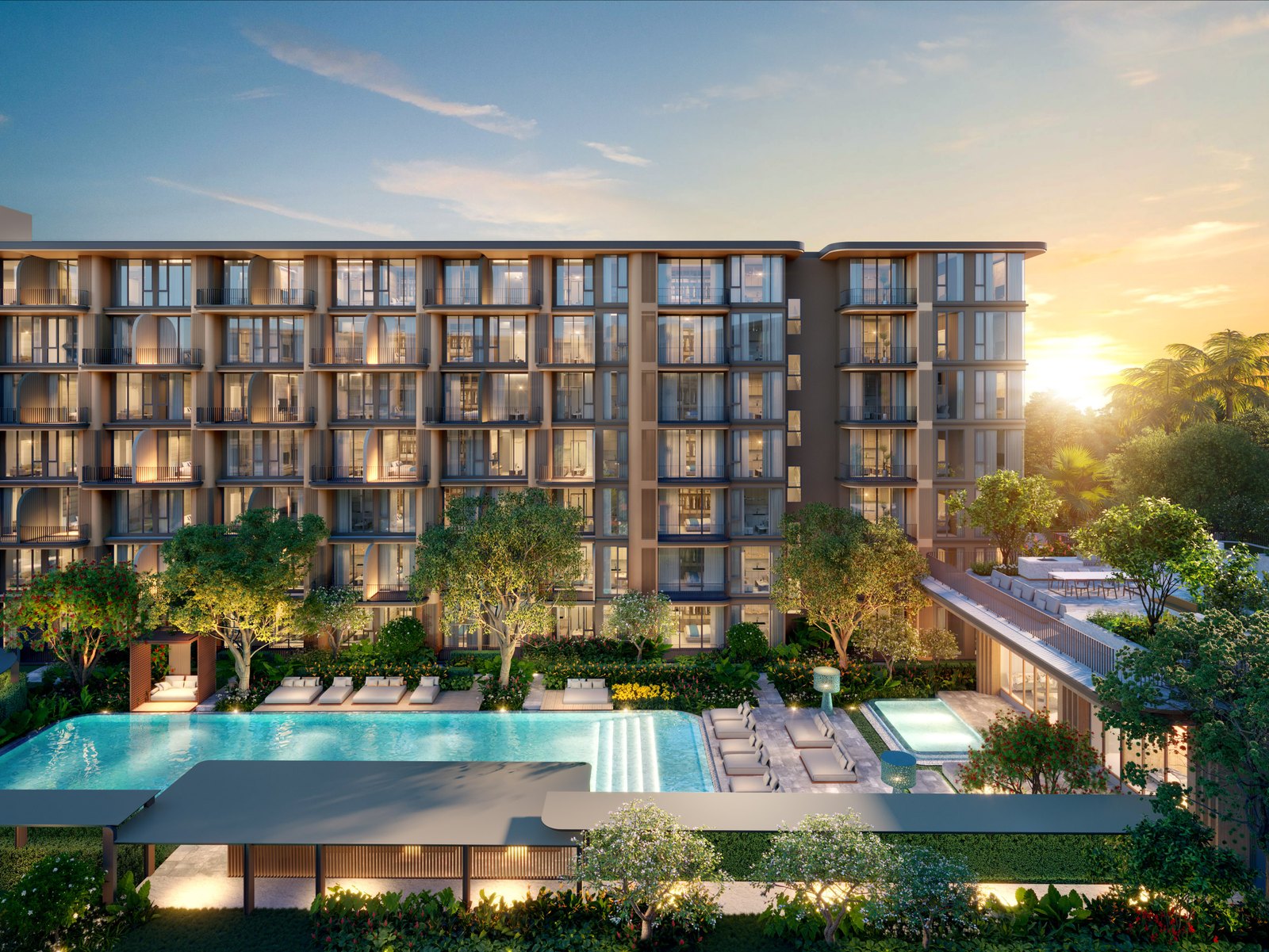 A residential building above its pool at dusk