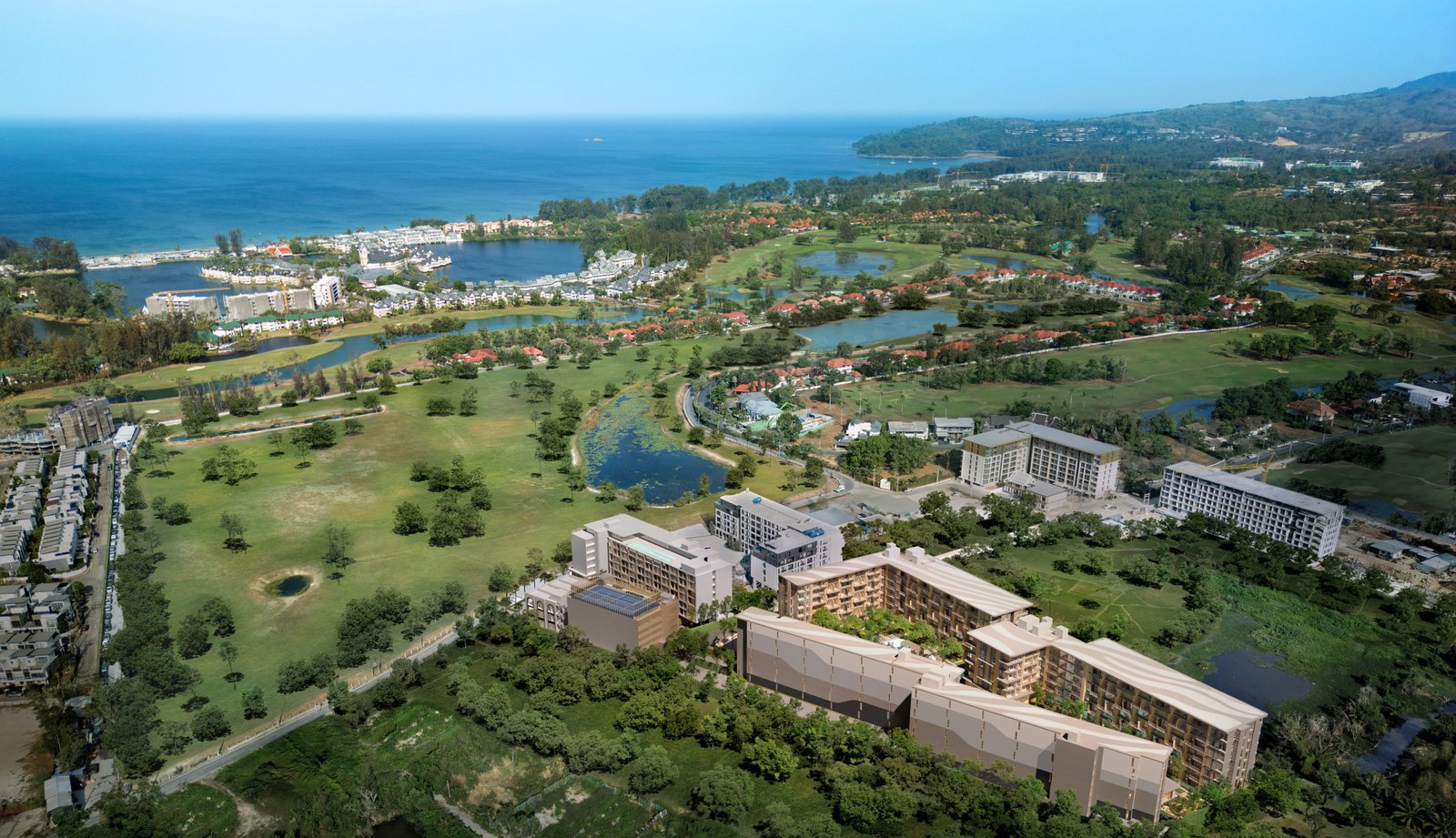 Aerial view across the golf course and lagoons to the bay
