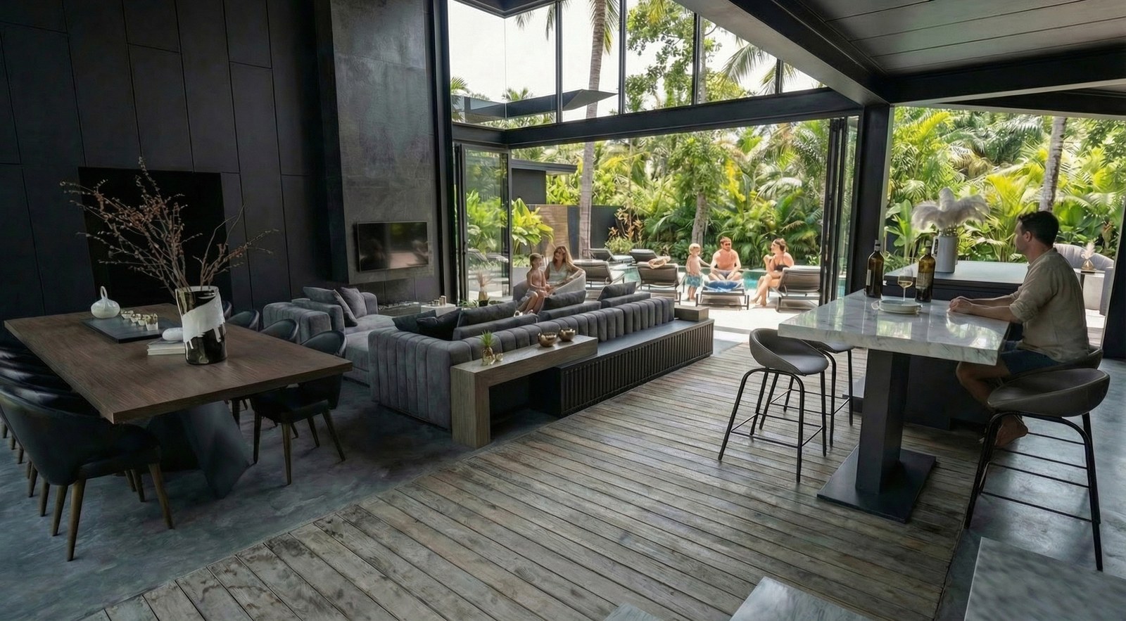 The living room opening onto the deck and the pool