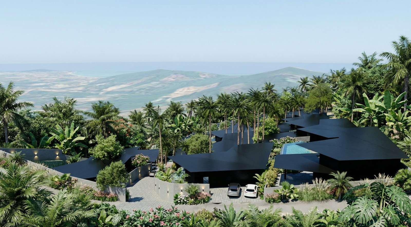 The estate on its hillside with the coast in the distance