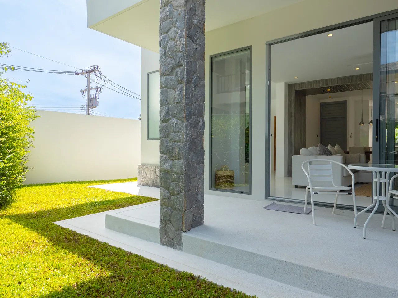 A private garden and the covered terrace behind it