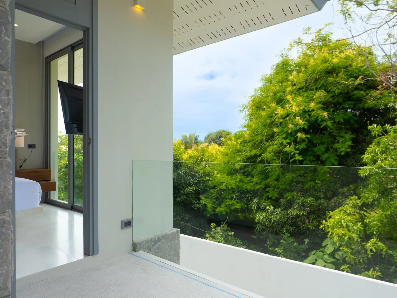 The upstairs balcony over the treetops