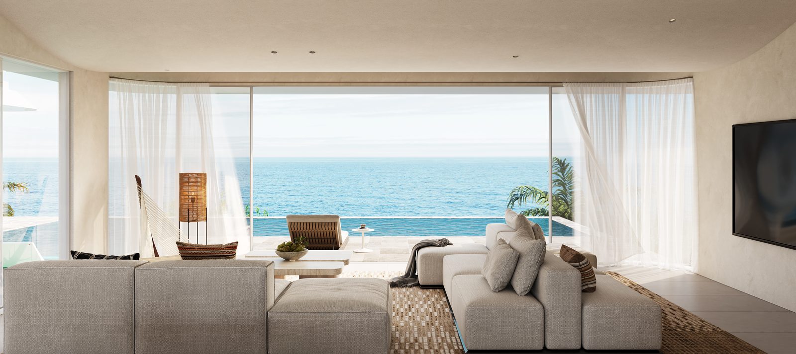 Four-bedroom villa living room opening to the sea