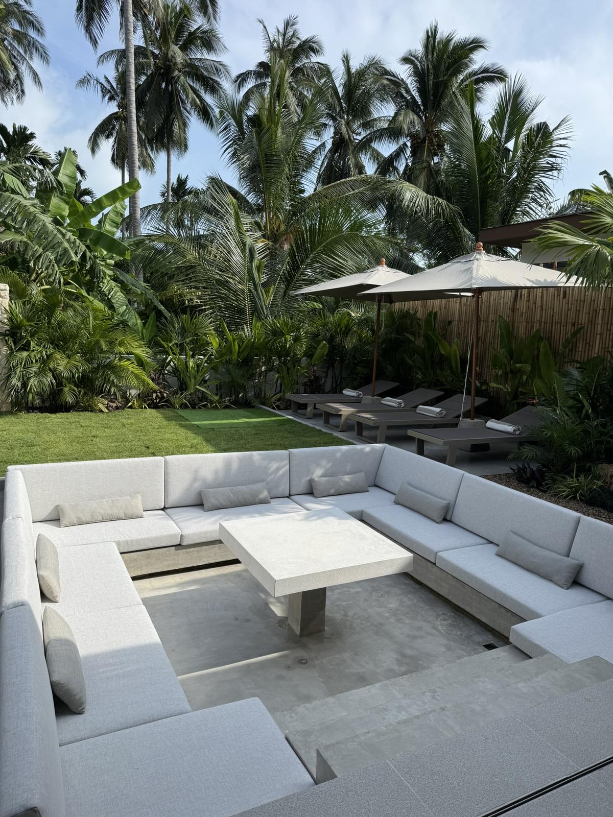Sunken lounge and lawn beside the pool