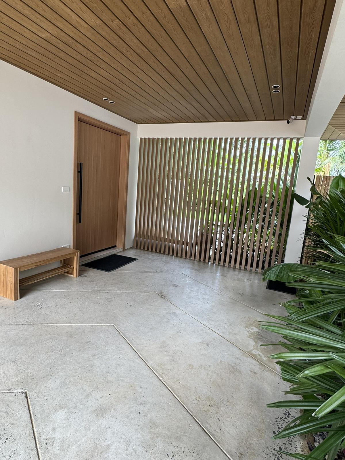 Covered entry walkway to the villa