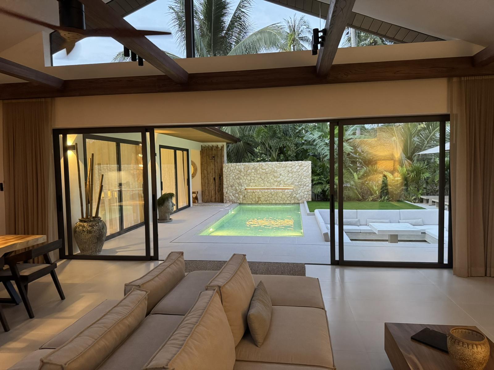 Living room with full-height glass onto the garden
