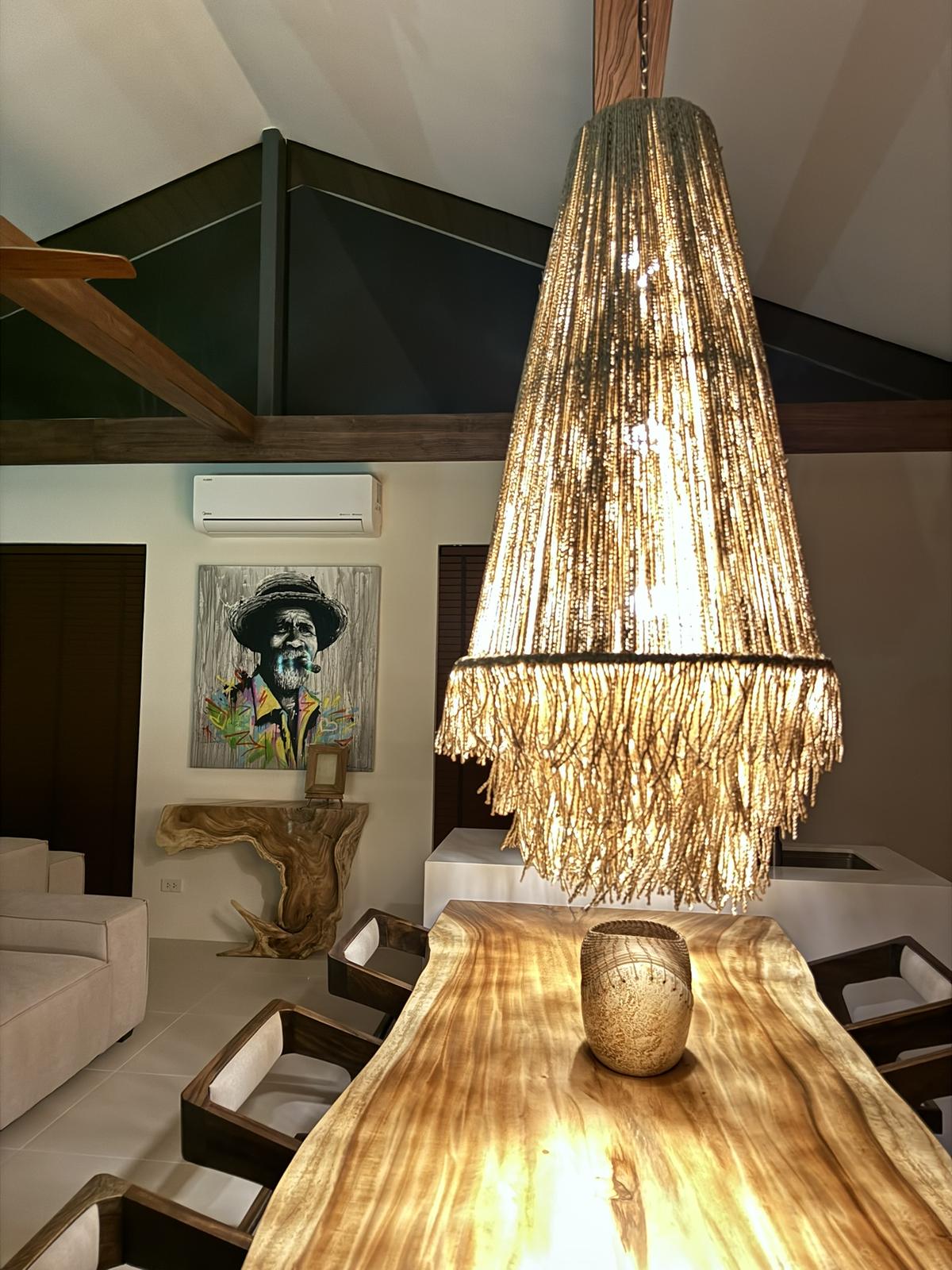 Woven pendant light above the entrance hall