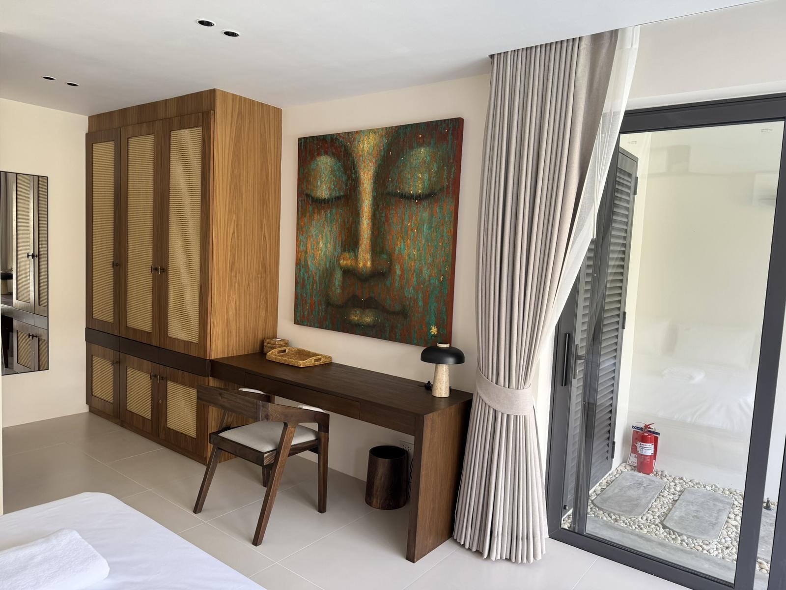 Fitted wardrobes and a dressing desk in the bedroom