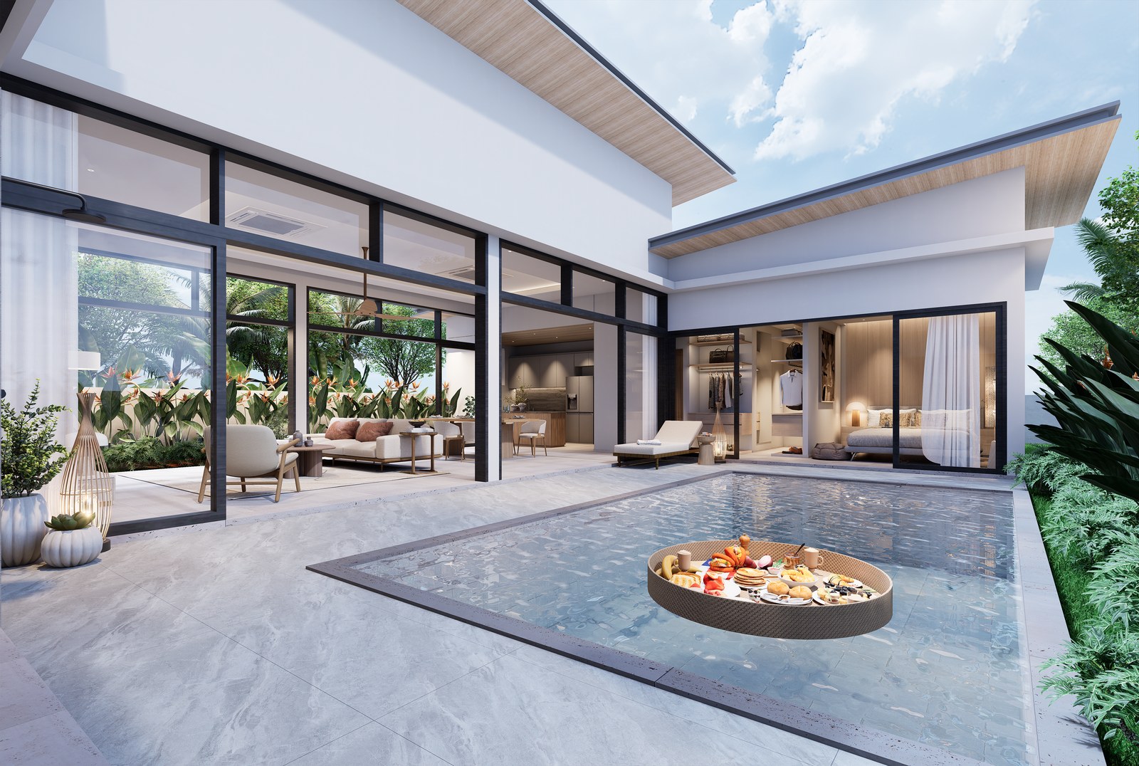 The pool terrace with the living room and bedrooms opening onto it