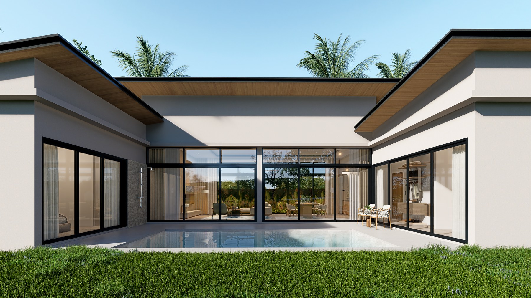 Open living room with full-height glazing onto the pool