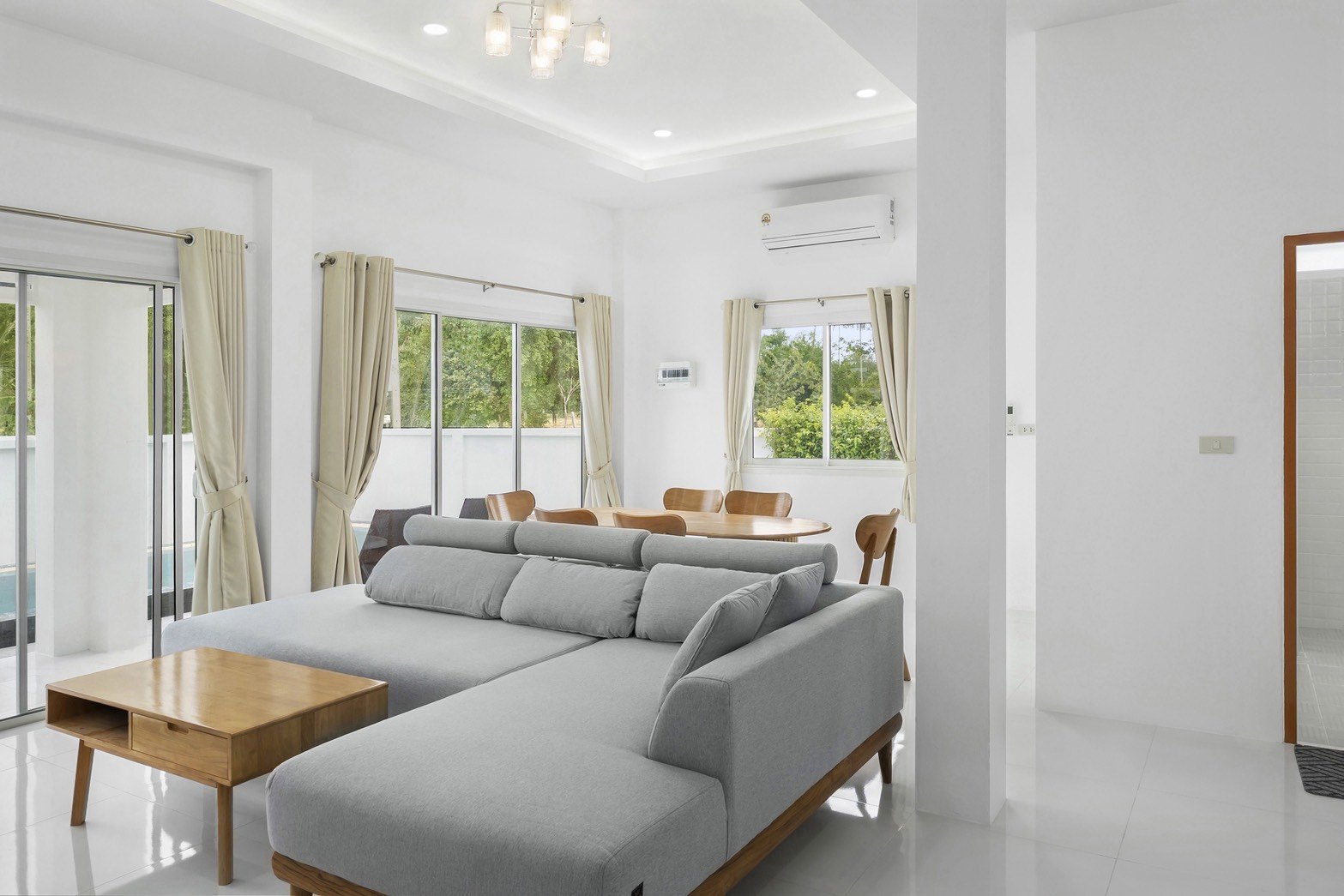 Open living and dining space of a furnished villa