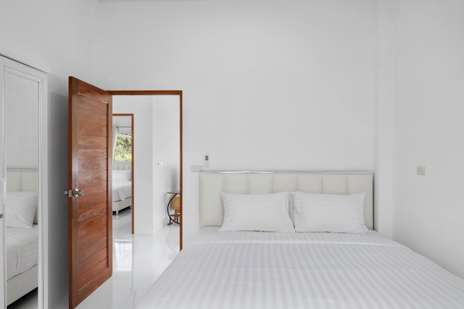 Master bedroom with a double bed and its own bathroom