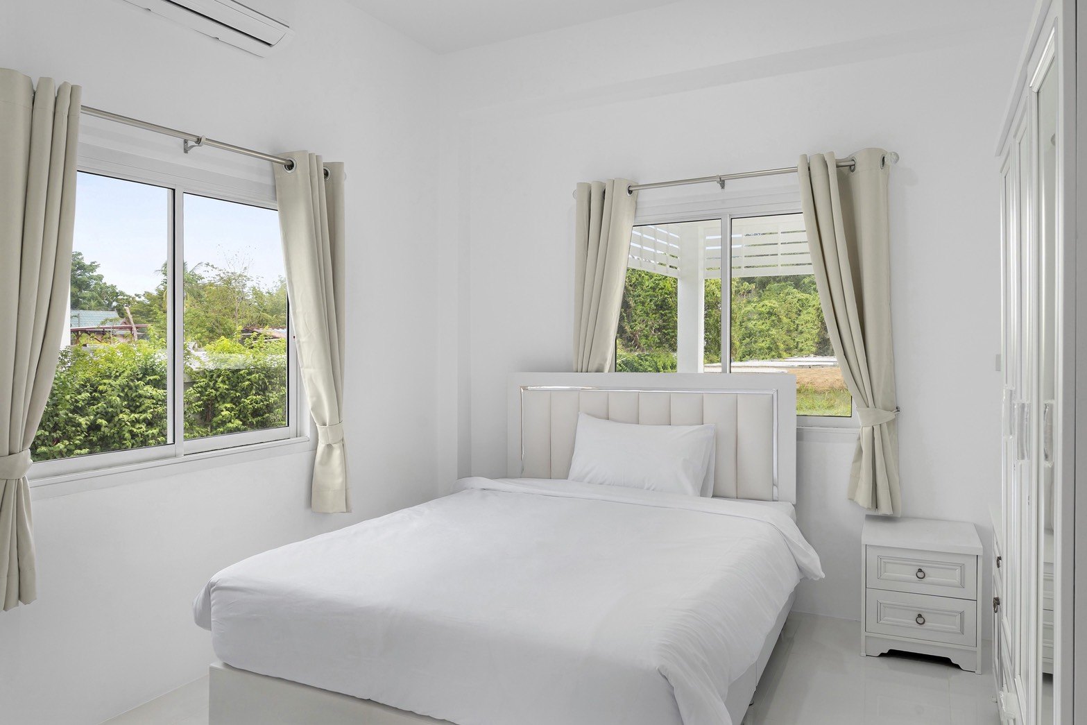 Third bedroom, bright and set up for guests
