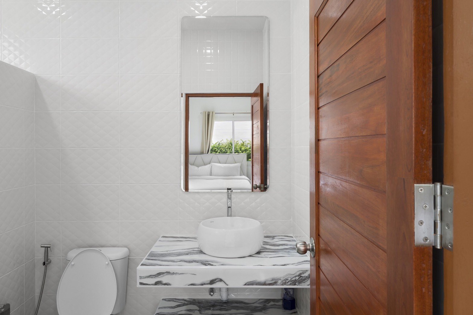 Bathroom with a marble-effect vanity and walk-in shower