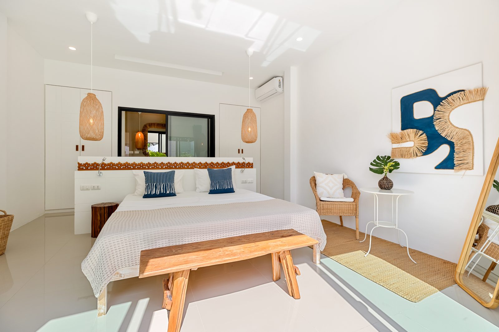 Bedroom with a writing desk and doors to the garden
