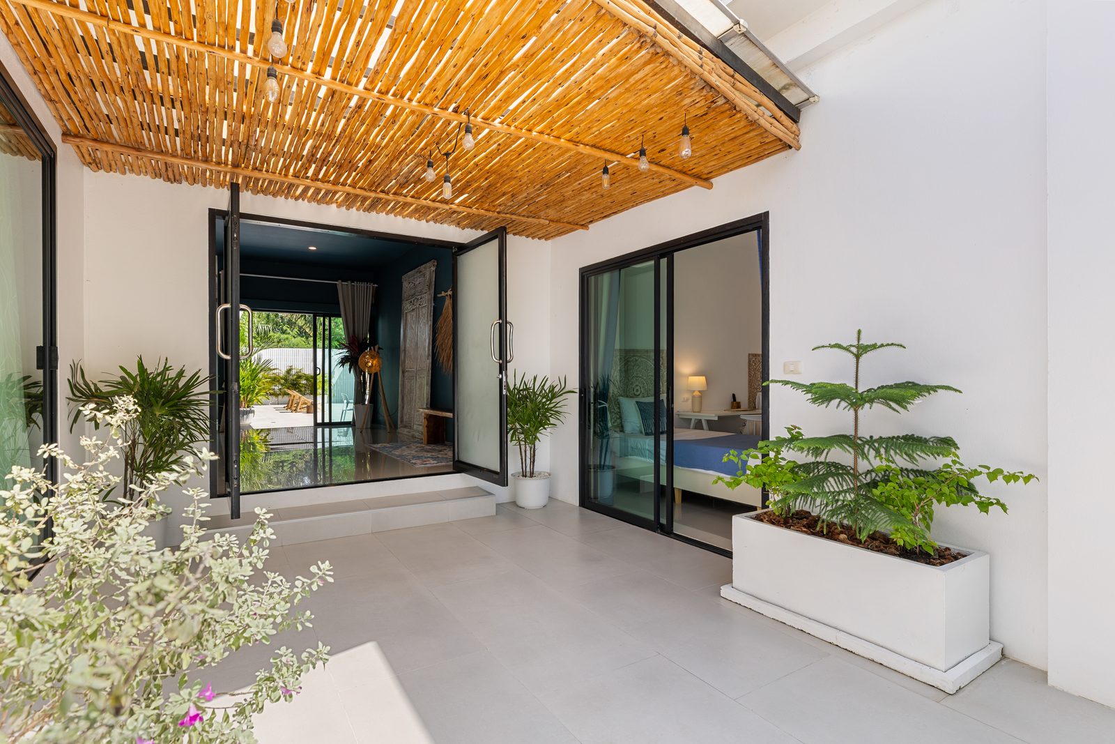 Entrance walkway under a bamboo ceiling