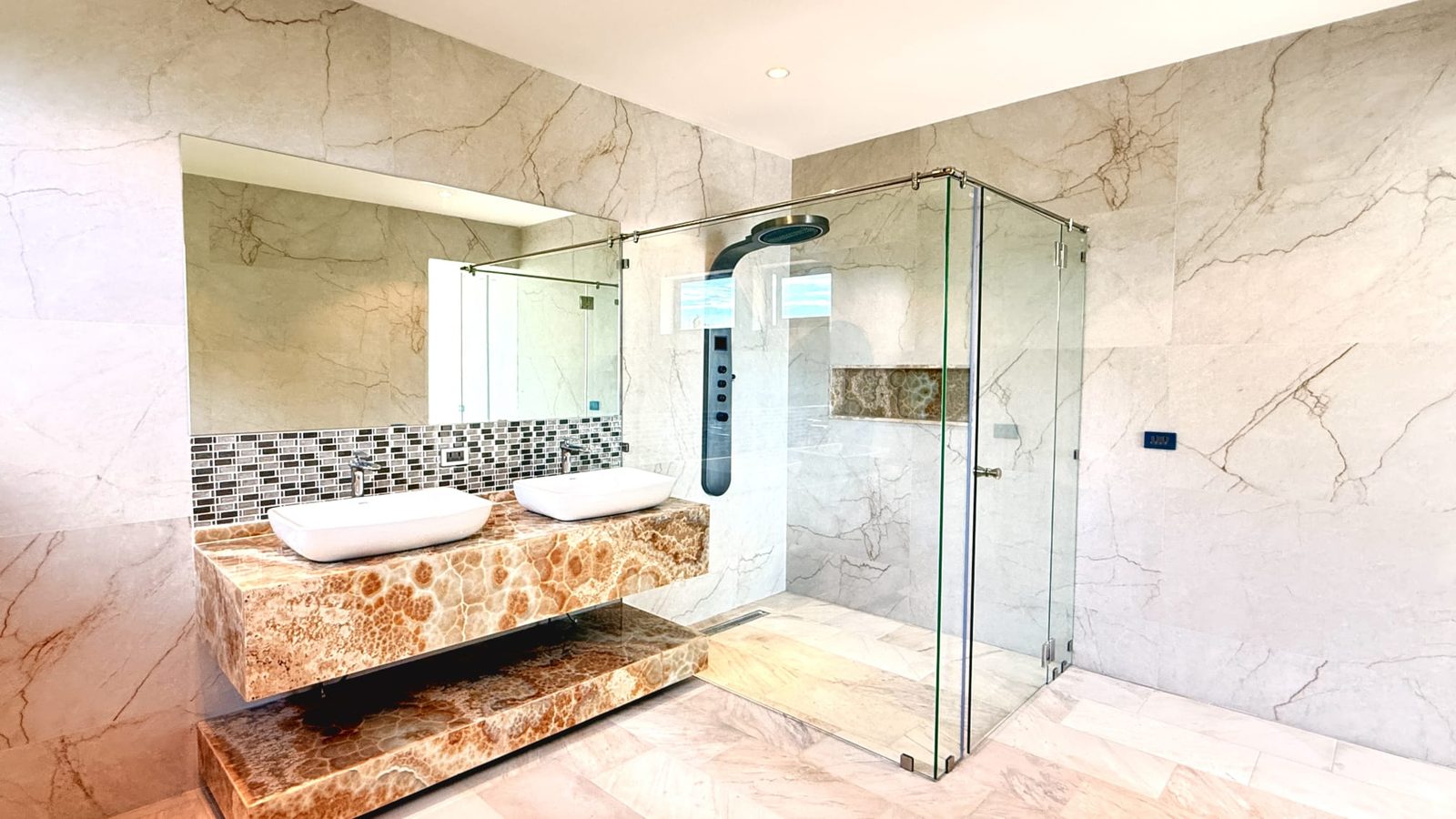 Bathroom as built, stone double vanity and glass shower