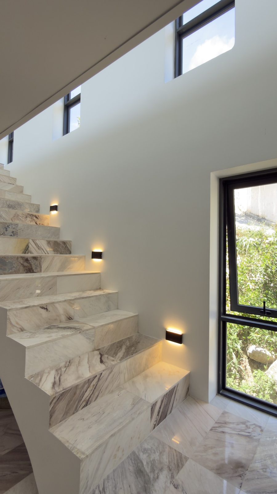 The marble staircase between the two levels