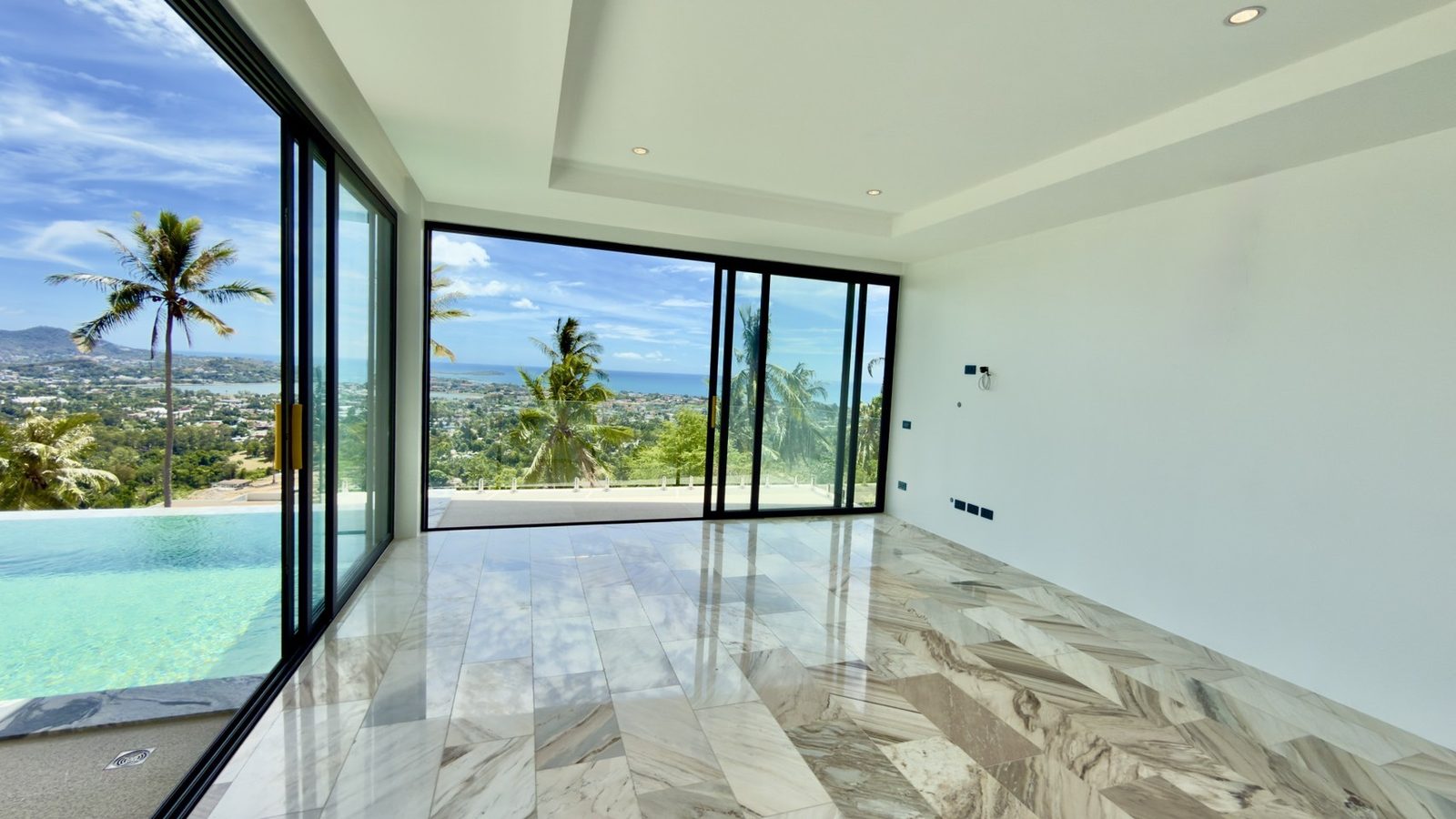 Room as built with the pool outside the glass