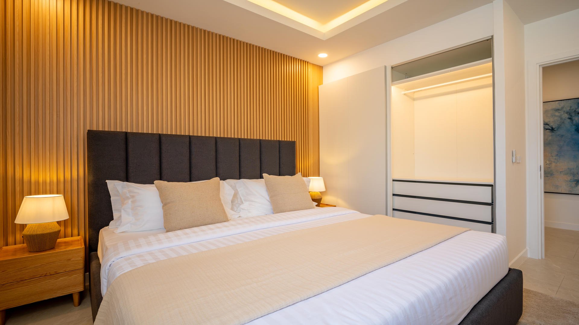 A double bedroom finished in darker timber