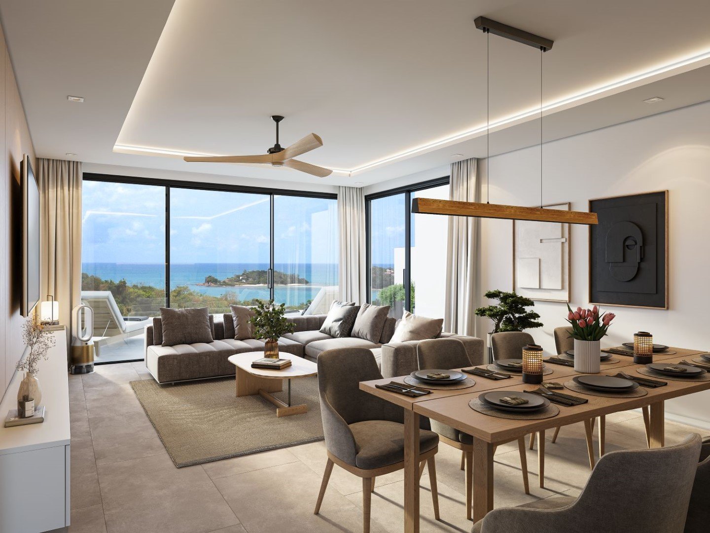 Living and dining space opening to the sea view