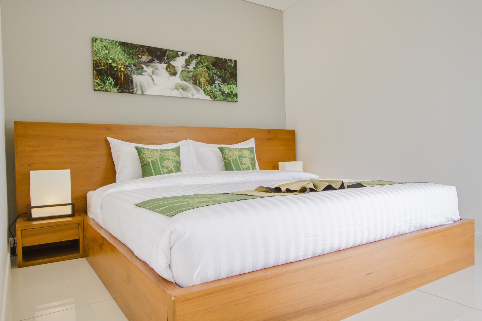 Main bedroom with a double bed and a garden outlook