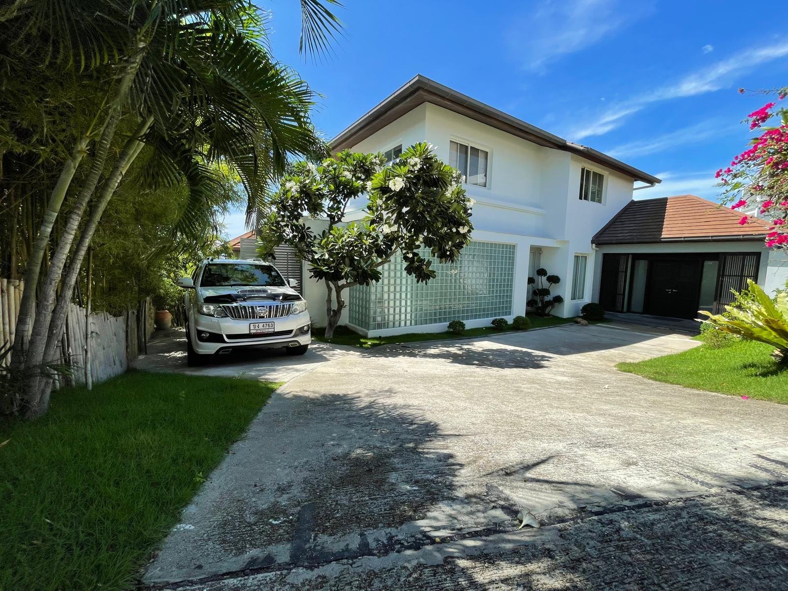 The driveway and the parking area at the entrance