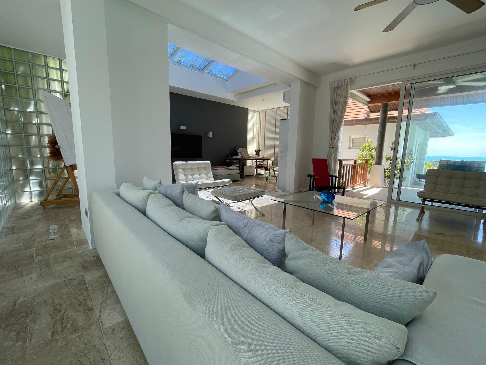 The lounge, glass sliding back to the terrace
