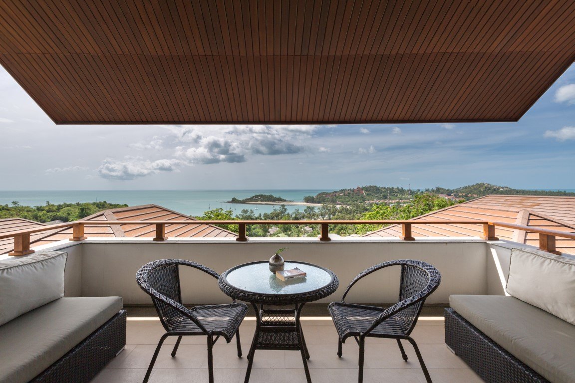 The covered terrace and the view down over the bay