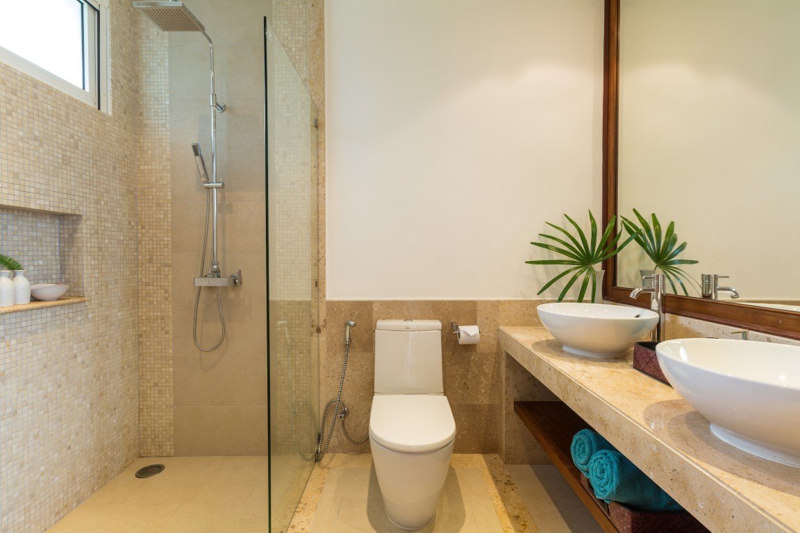 A guest bathroom with a walk-in shower