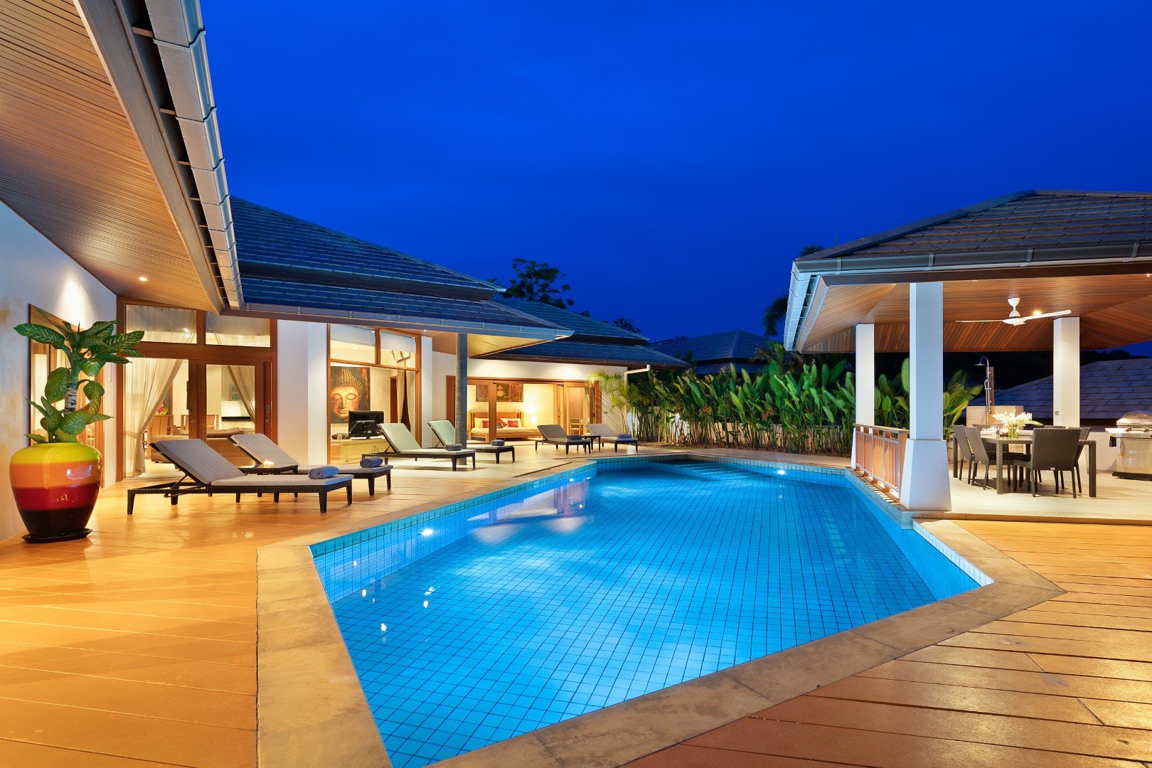 The pool and the villa at dusk
