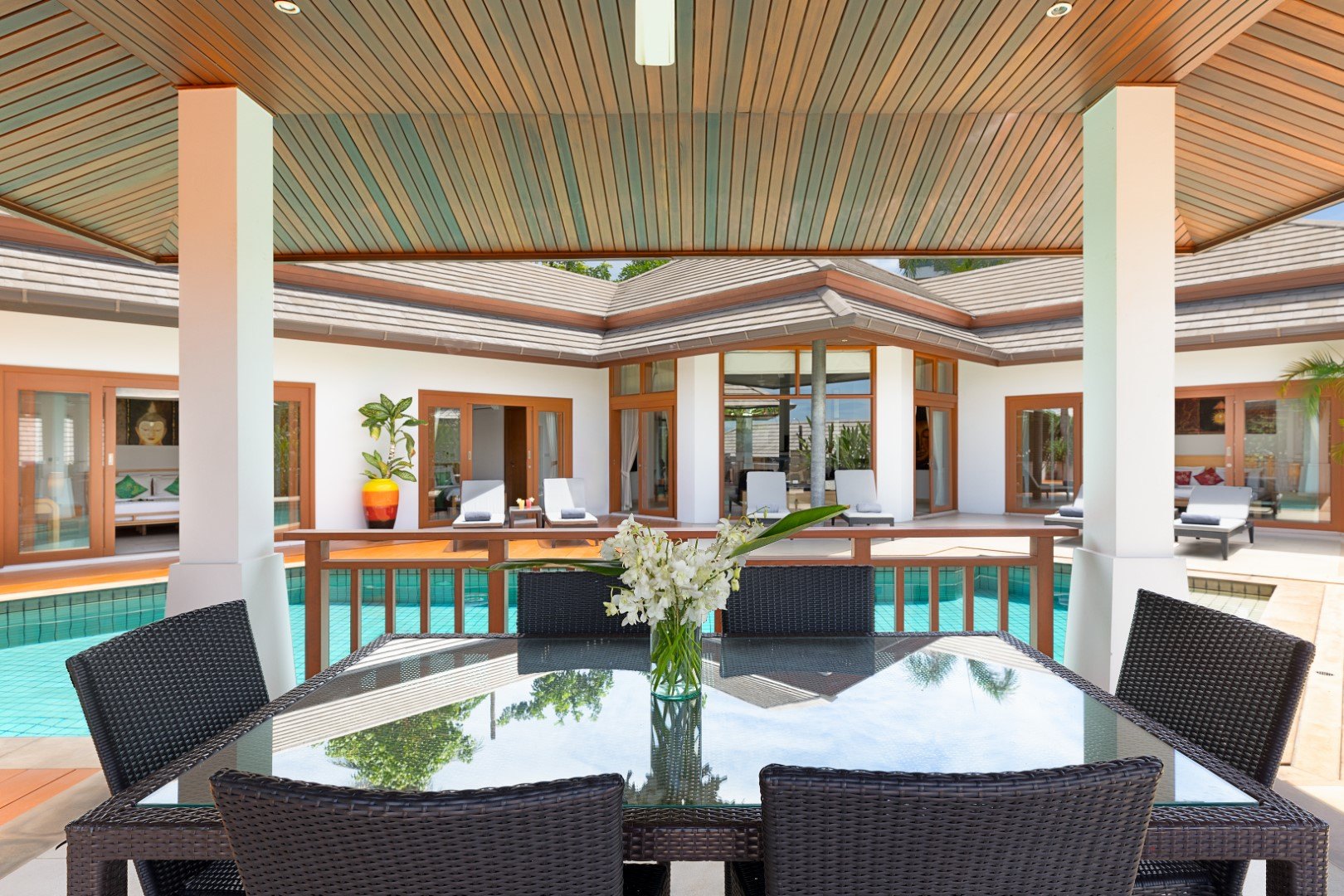 The outdoor dining table under the terrace roof