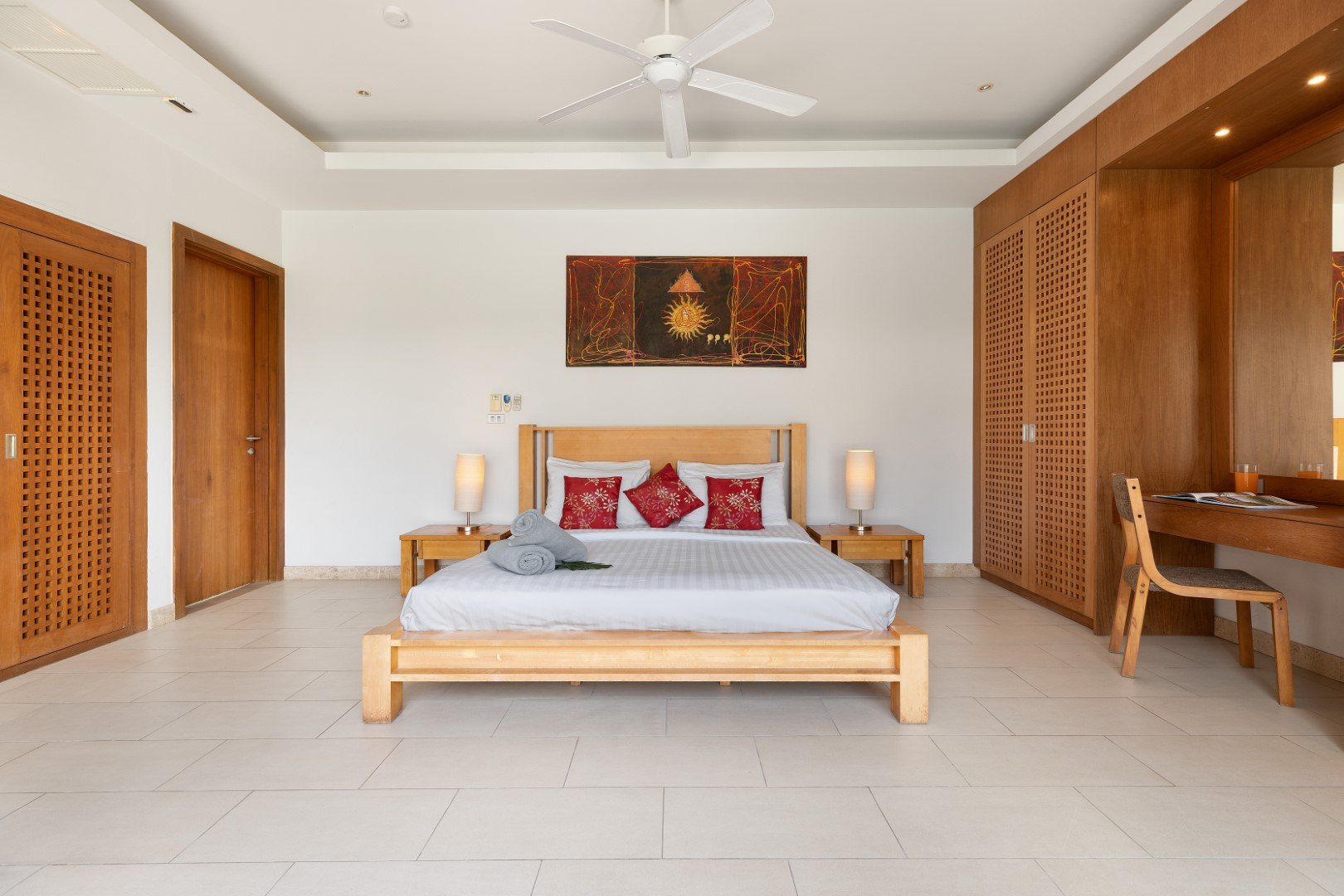 A bedroom with its own doors to the terrace