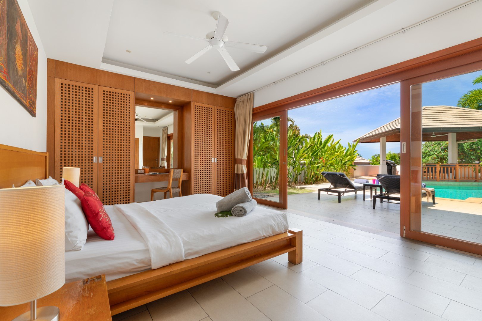 A bedroom looking straight out to the pool