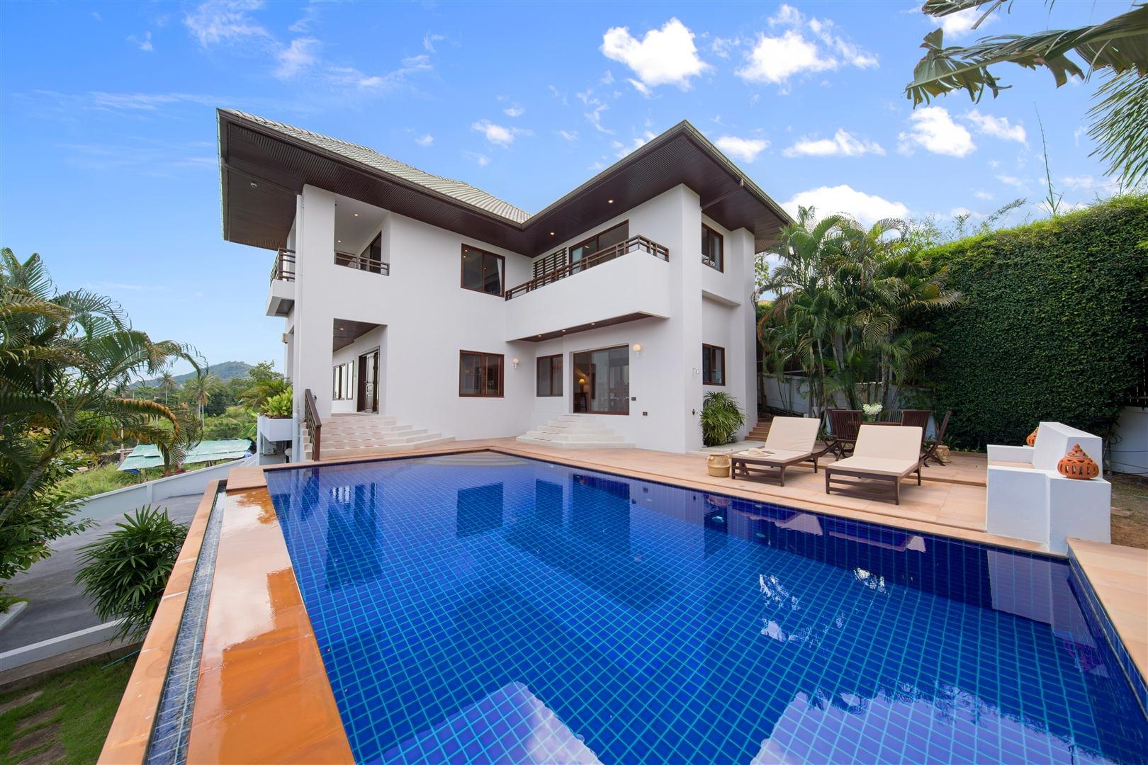 The pool terrace and the house behind it