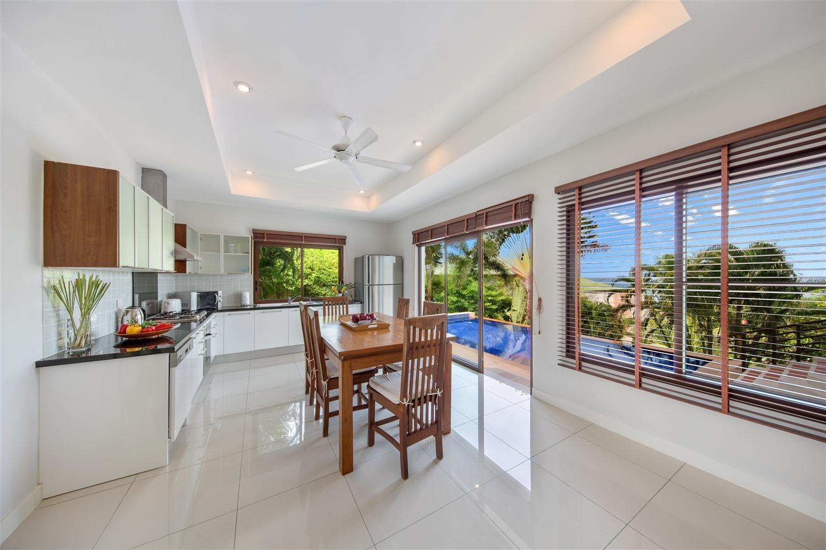 The kitchen and dining area with the view beyond