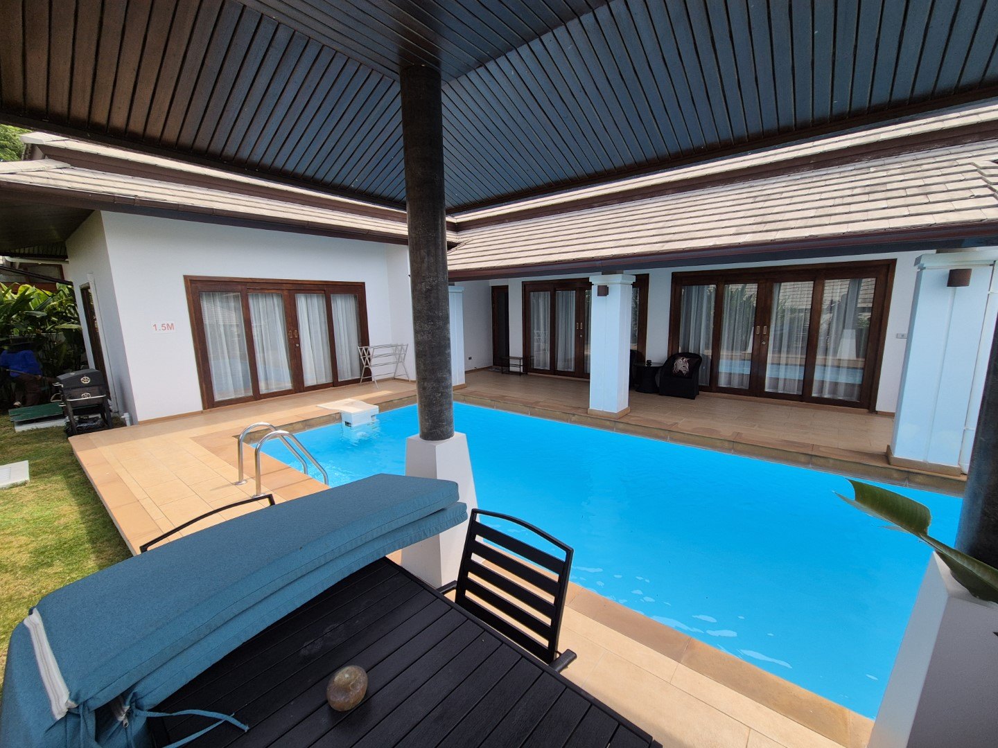 The pool and its deck along the front of the villa