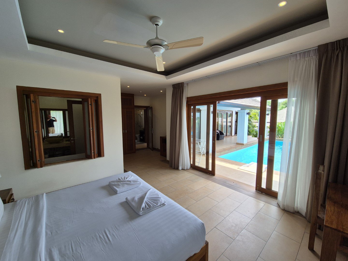 A bedroom opening straight onto the pool