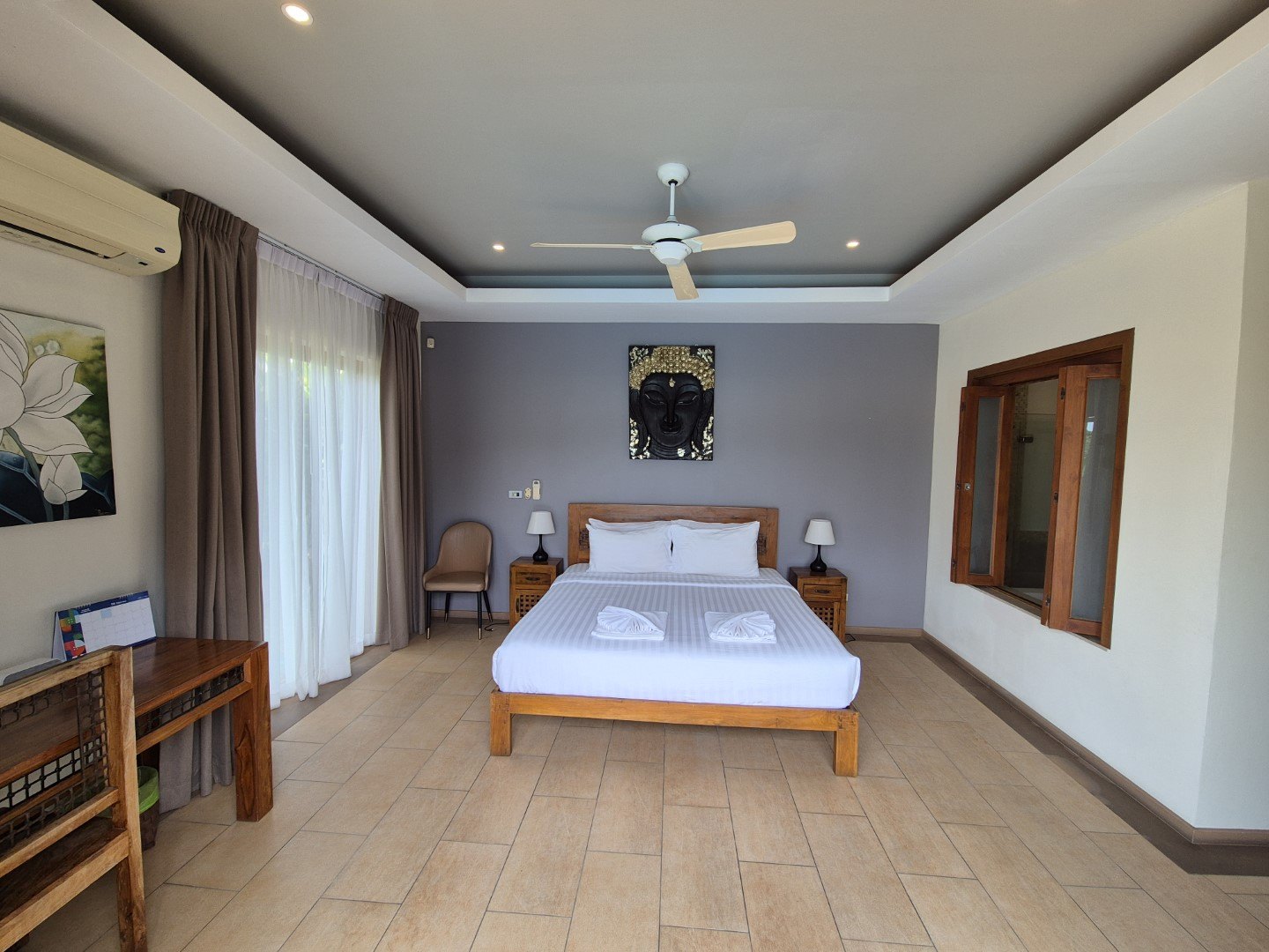 The second bedroom with wardrobes along the wall