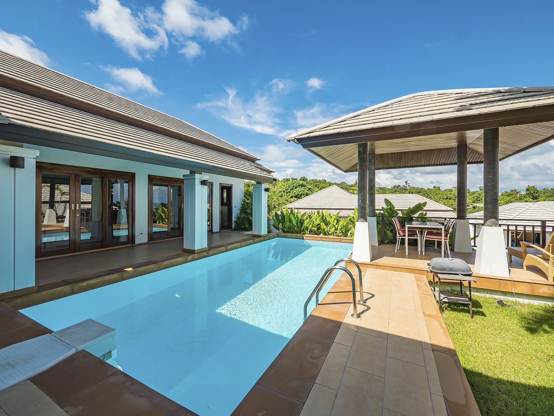The pool and its deck along the front of the villa