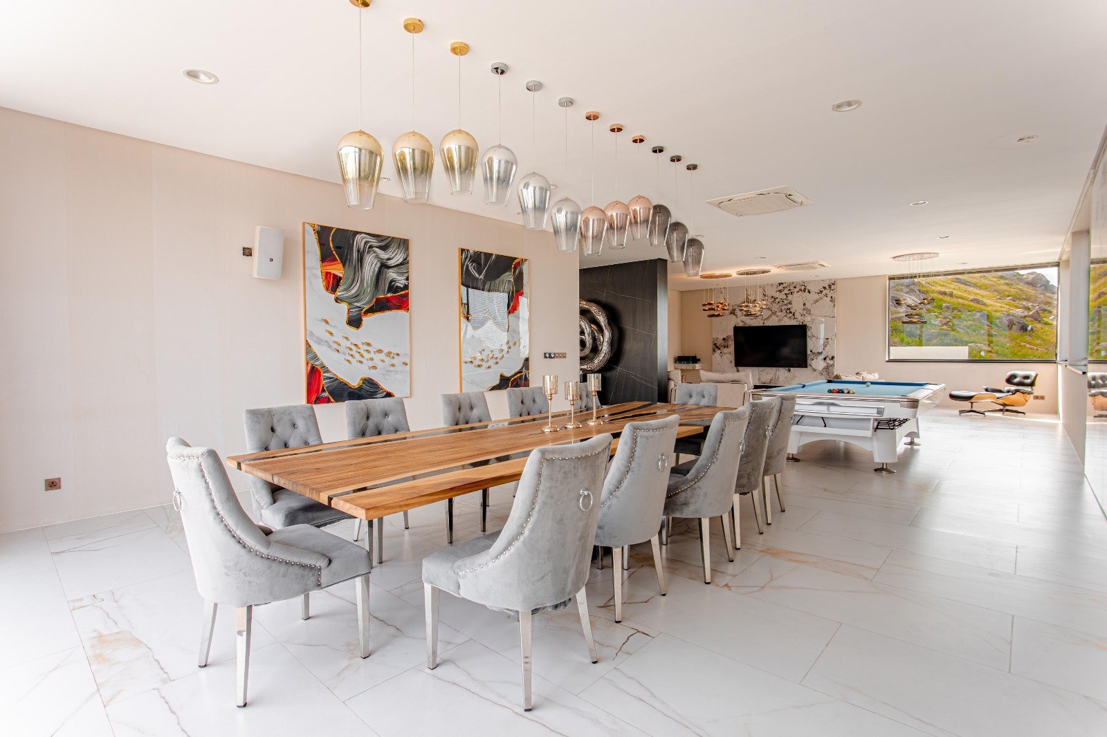 The long dining table set for sixteen