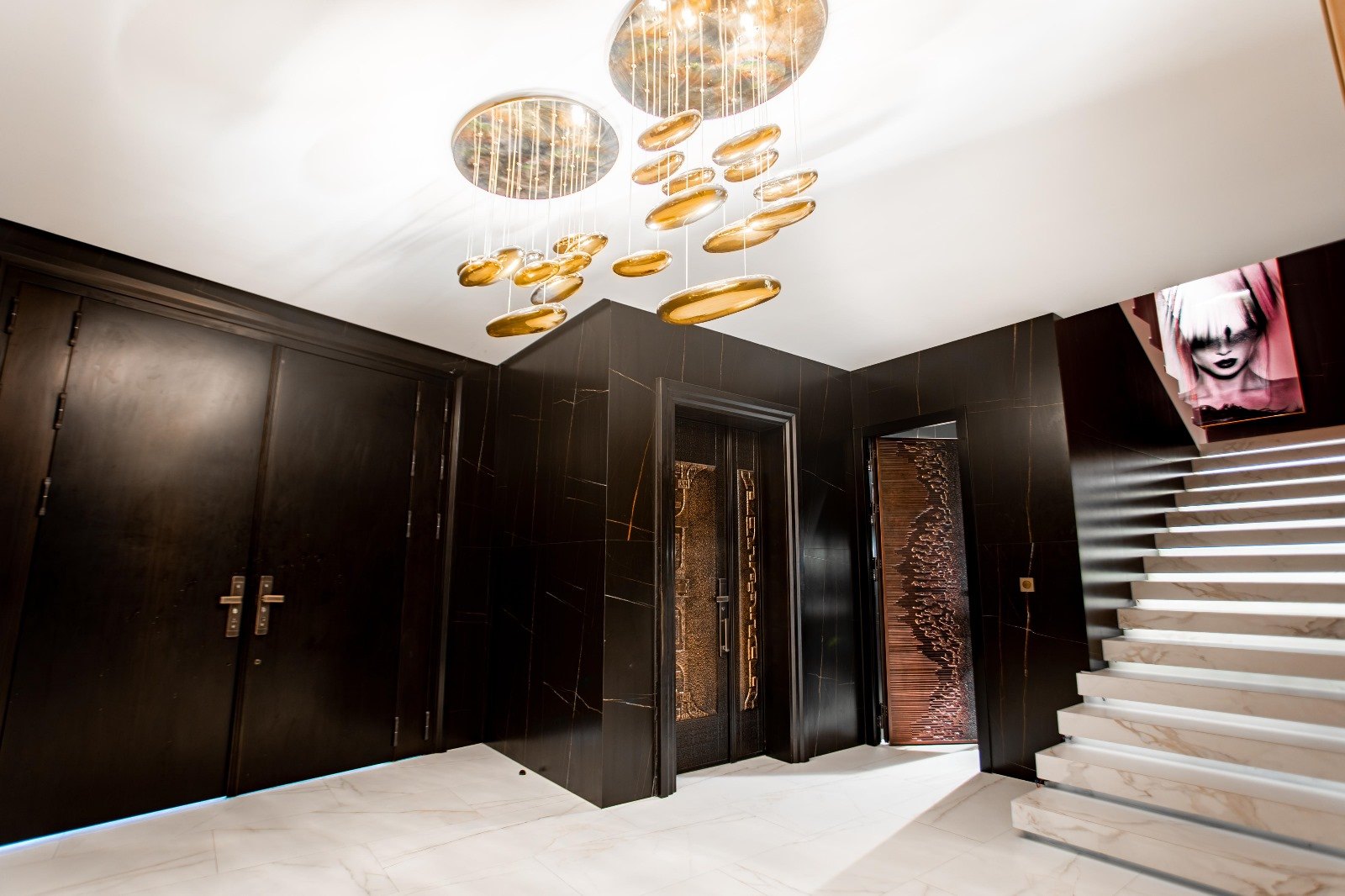 The black marble entrance hall and staircase