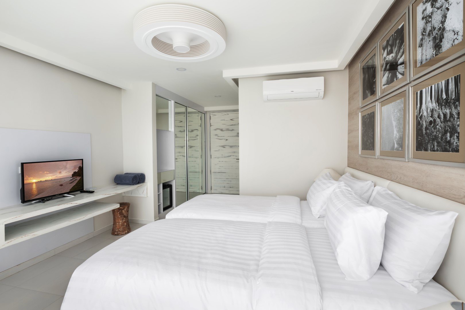 A bedroom with its own glass door to the terrace