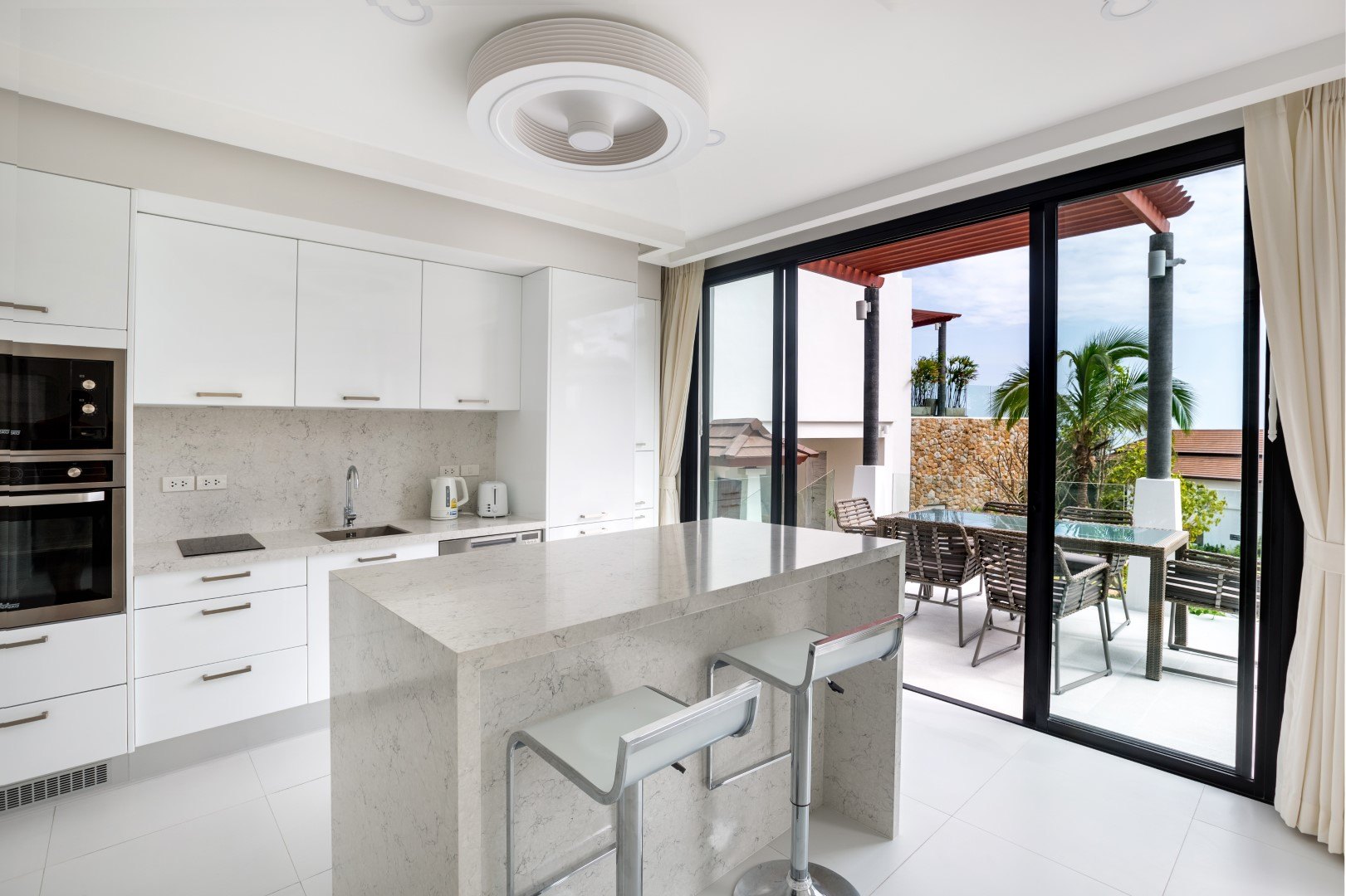The fitted kitchen and the doors onto the terrace