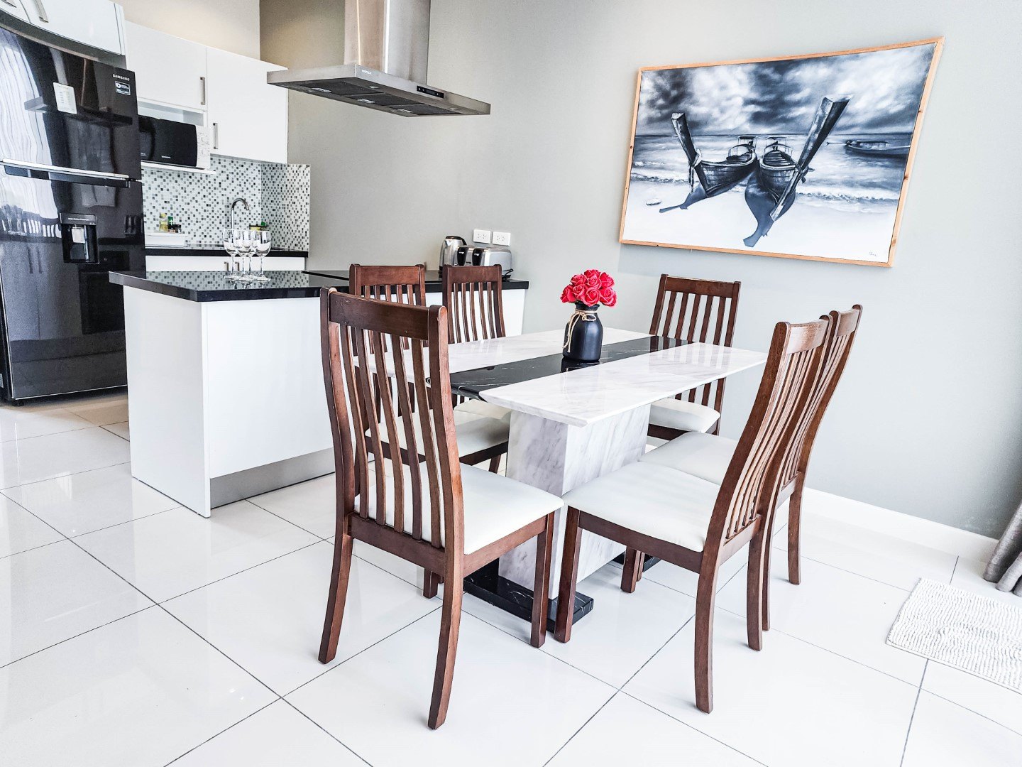 The fitted kitchen behind the dining space