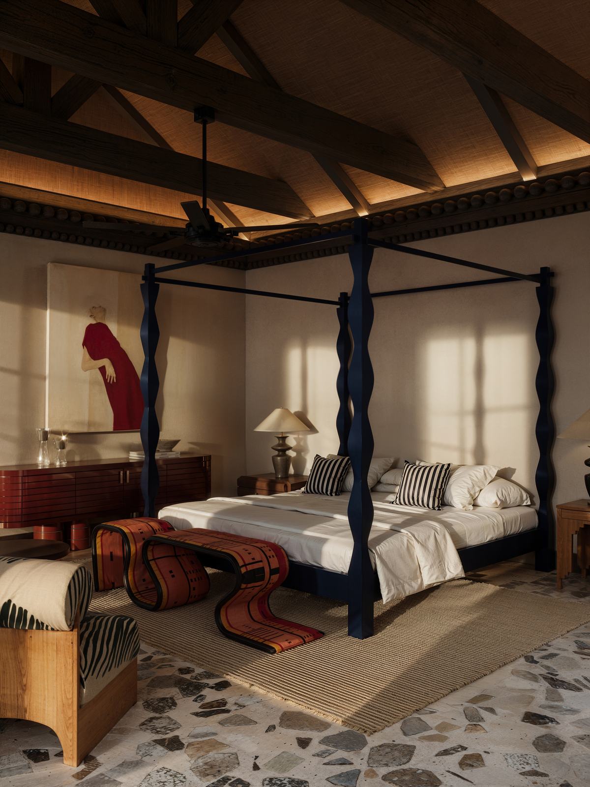 Master bedroom with a four-poster bed under a vaulted ceiling