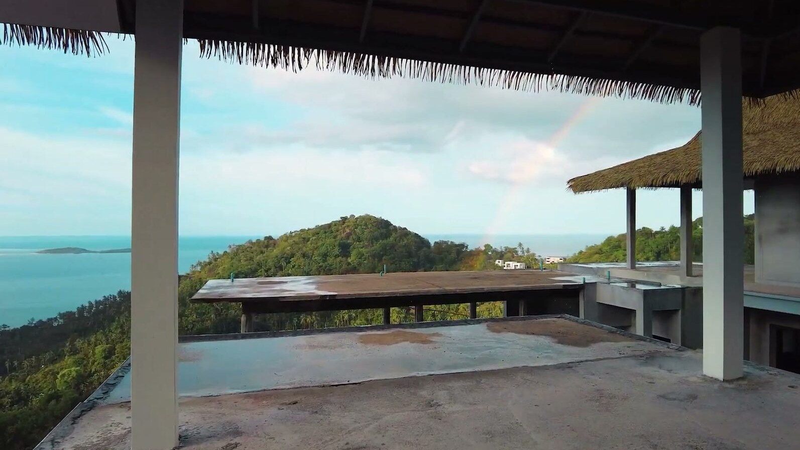 The open terrace under its thatched roof, looking out to sea
