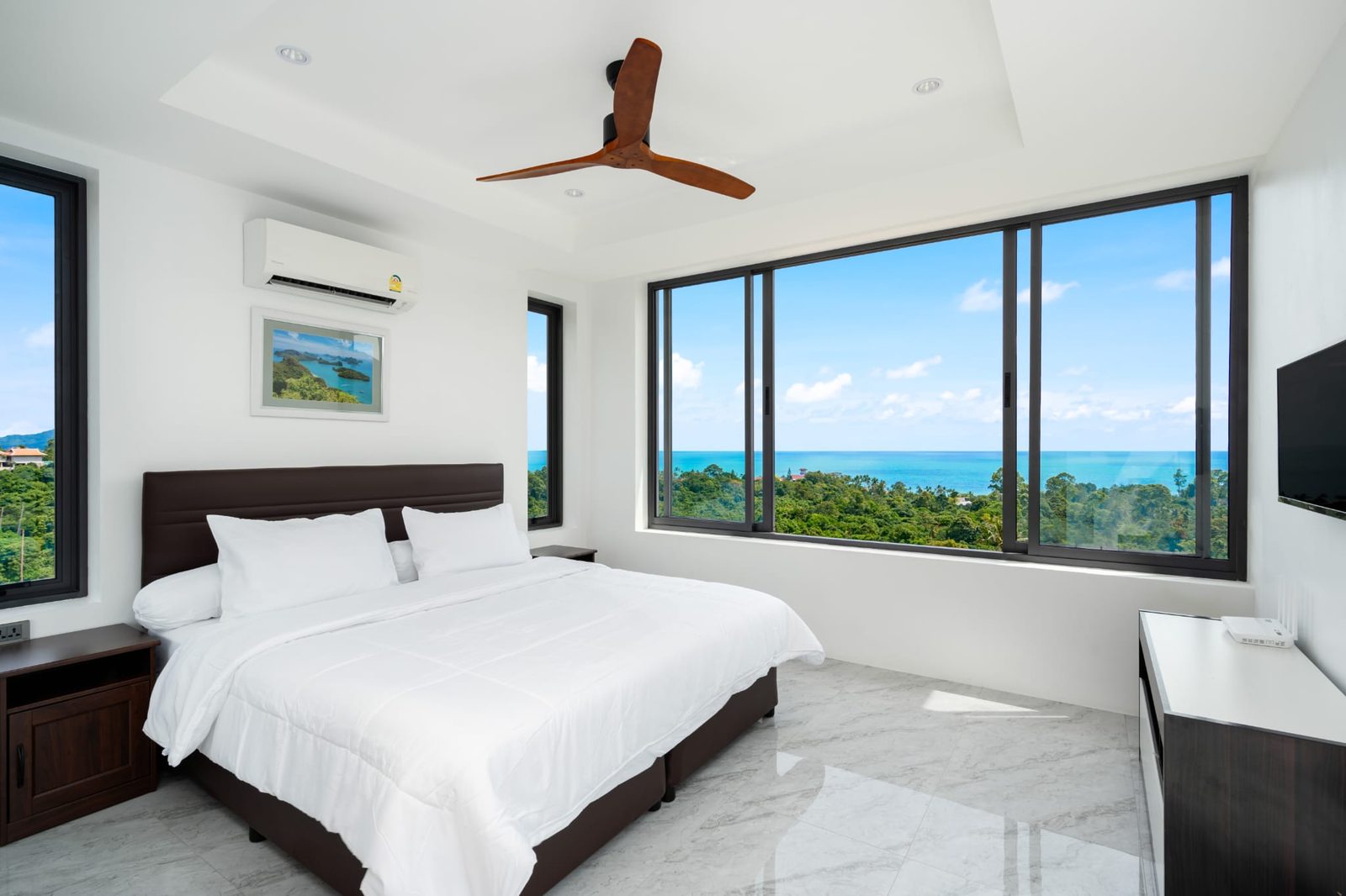 Master bedroom with corner windows to the sea