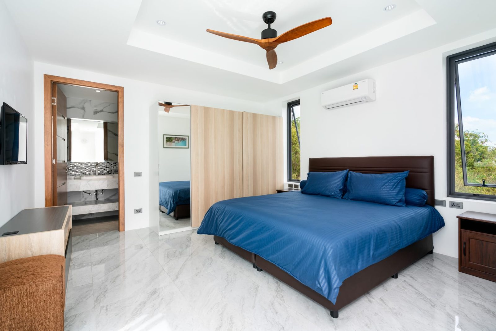Bedroom with a window to the hillside